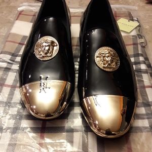 Men's Black Versace loafers with gold detailing